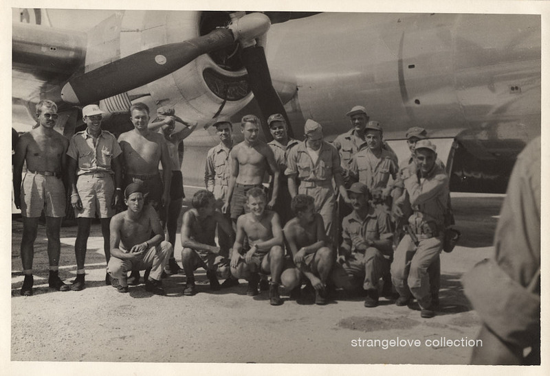 Crew of the Enola Gay posing shirtless beside the aircraft, Tinian, 1945 (unofficial, amateur print).