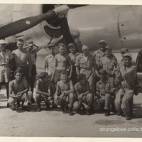 Crew of the Enola Gay posing shirtless beside the aircraft, Tinian, 1945 (unofficial, amateur print).